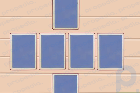 Passo 2 Coloque quatro pilhas de cartas viradas para baixo entre os dois jogadores.