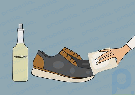 Step 4 Use white vinegar to remove salt stains on your leather shoes.