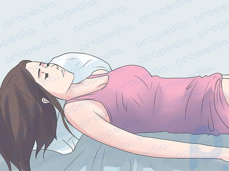 Step 2 Lie straight on your stomach to strengthen your back.