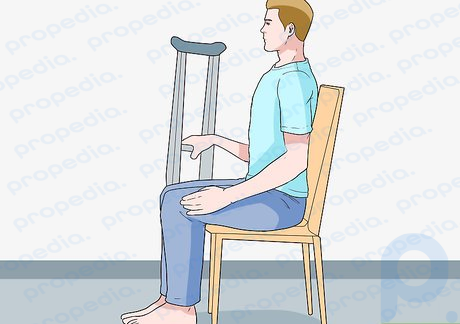 Step 4 Use the crutches to help you sit.
