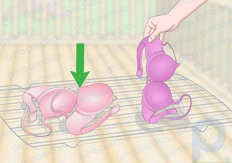 Step 3 Lay the bras flat on a towel or drying rack and let them air dry.