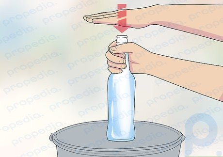 Step 3 Strike the bottle with your other hand.