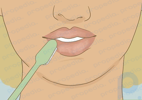 Step 1 Exfoliate your lips with a toothbrush to smooth and plump them.