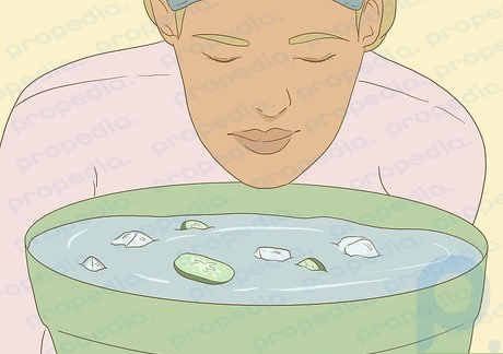 Step 2 Dunk your face into ice water and cucumbers to reduce puffiness.
