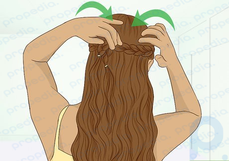 Step 6 Secure both braids behind your head, like a half-up, half-down ponytail.