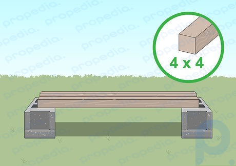 Paso 2 Coloque 2 tablas de 4x4 encima de los bloques de cemento.