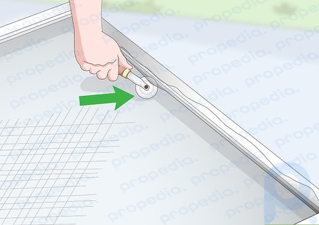 Step 4 Roll the spline roller on the screen before inserting the splines.