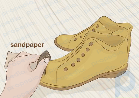 Step 2 Scuff up your footwear with sandpaper.