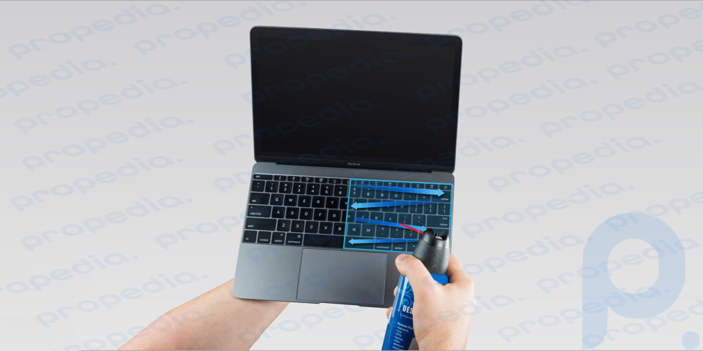 How to clean your MacBook keyboard: Blow the keyboard with compressed air