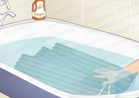 Step 2 Submerge shades in a bathtub for a deep cleaning.