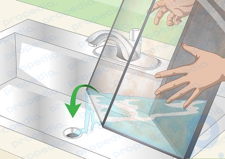 Step 2 Drain or pour out any old water into a bucket or sink.