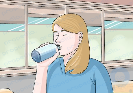 Step 2 Sip clear liquid to calm your stomach.
