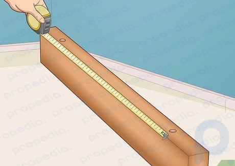Step 1 Measure the distance between the screw slots on your shelving.