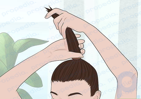 Step 1 Wet your hair and pull it into a ponytail at the top of your head.
