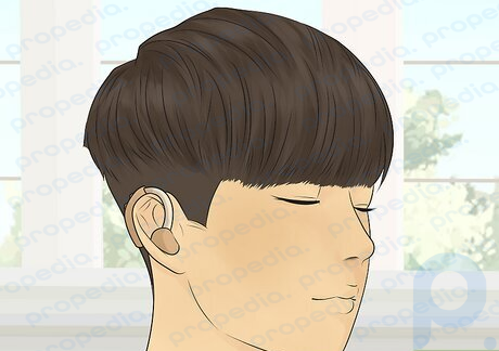 The two block haircut looks like a mushroom cut with shaved sides.